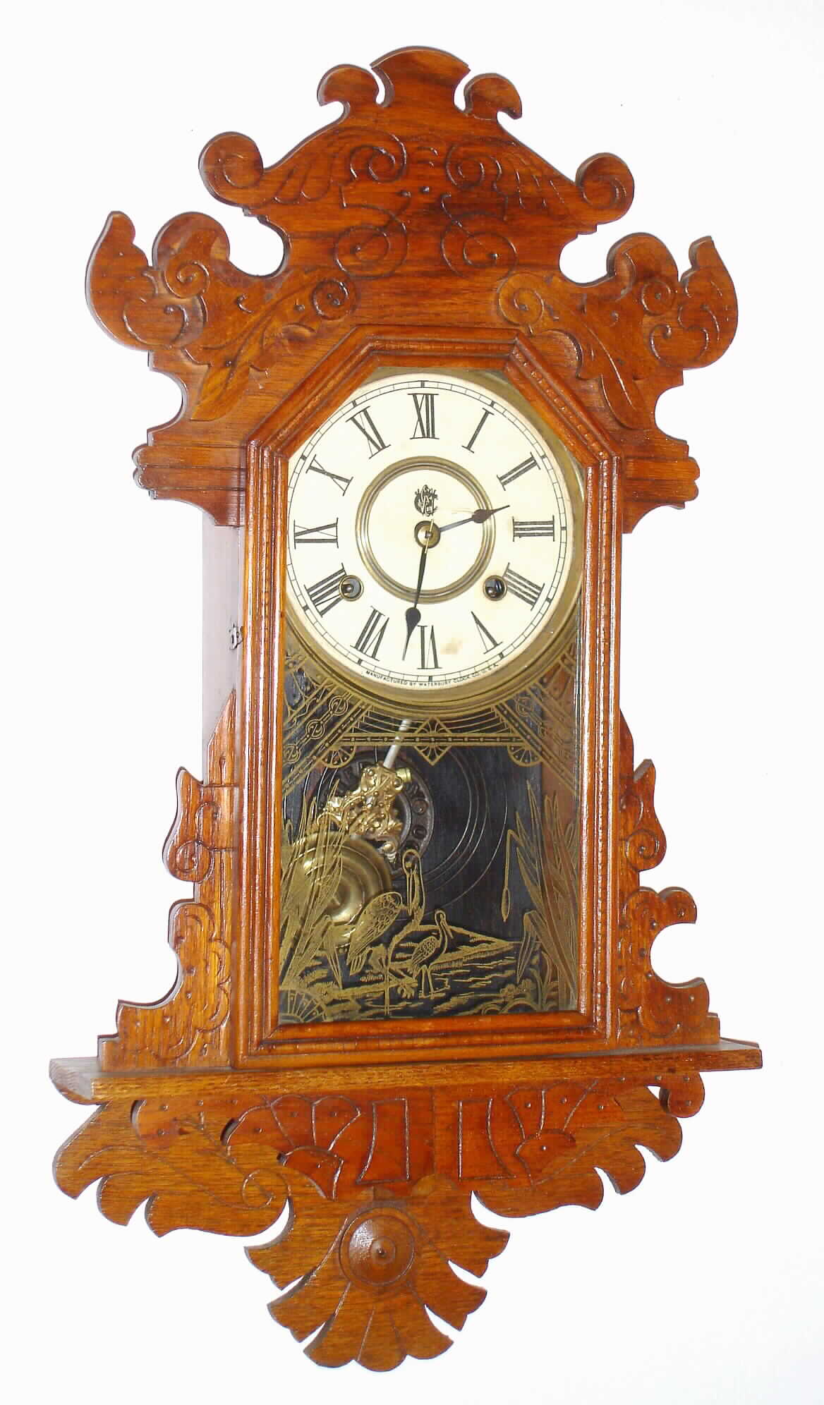 Waterbury Clock Co., Waterbury, Conn., oak 8 day, time and strike hanging gingerbread clock, c1891 — Antique Clocks Price Guide