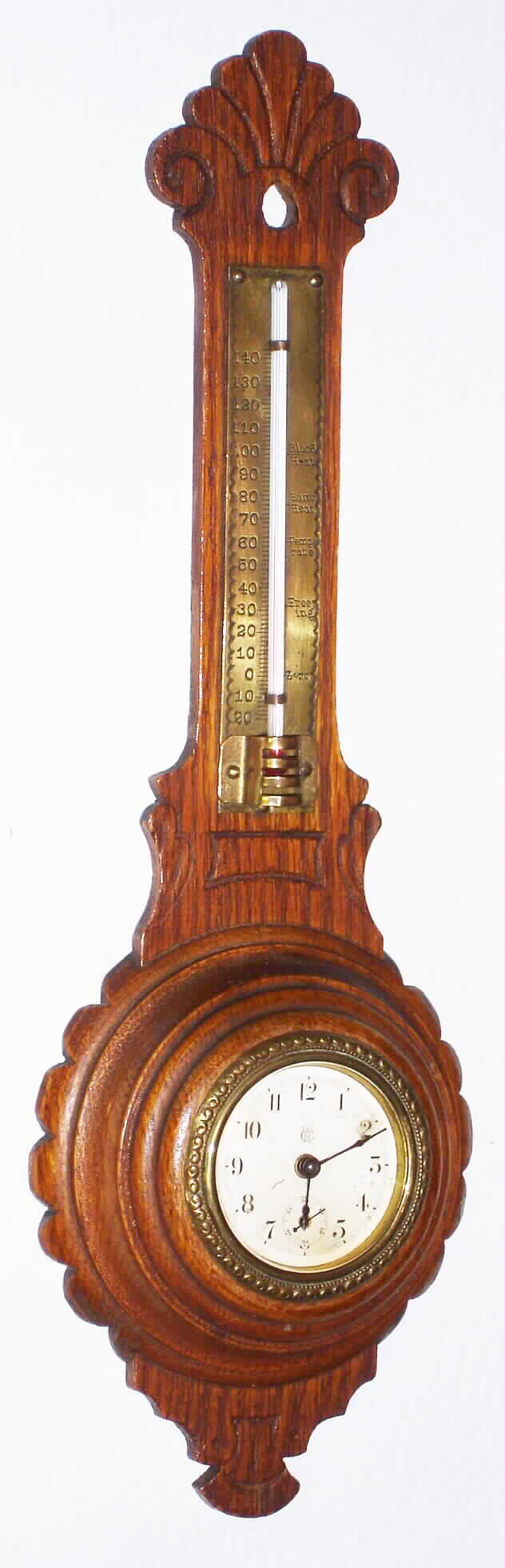 Waterbury Clock Co., Waterbury, Conn., oak hanging 30 hour time piece and thermometer, c1900 — Antique Clocks Price Guide