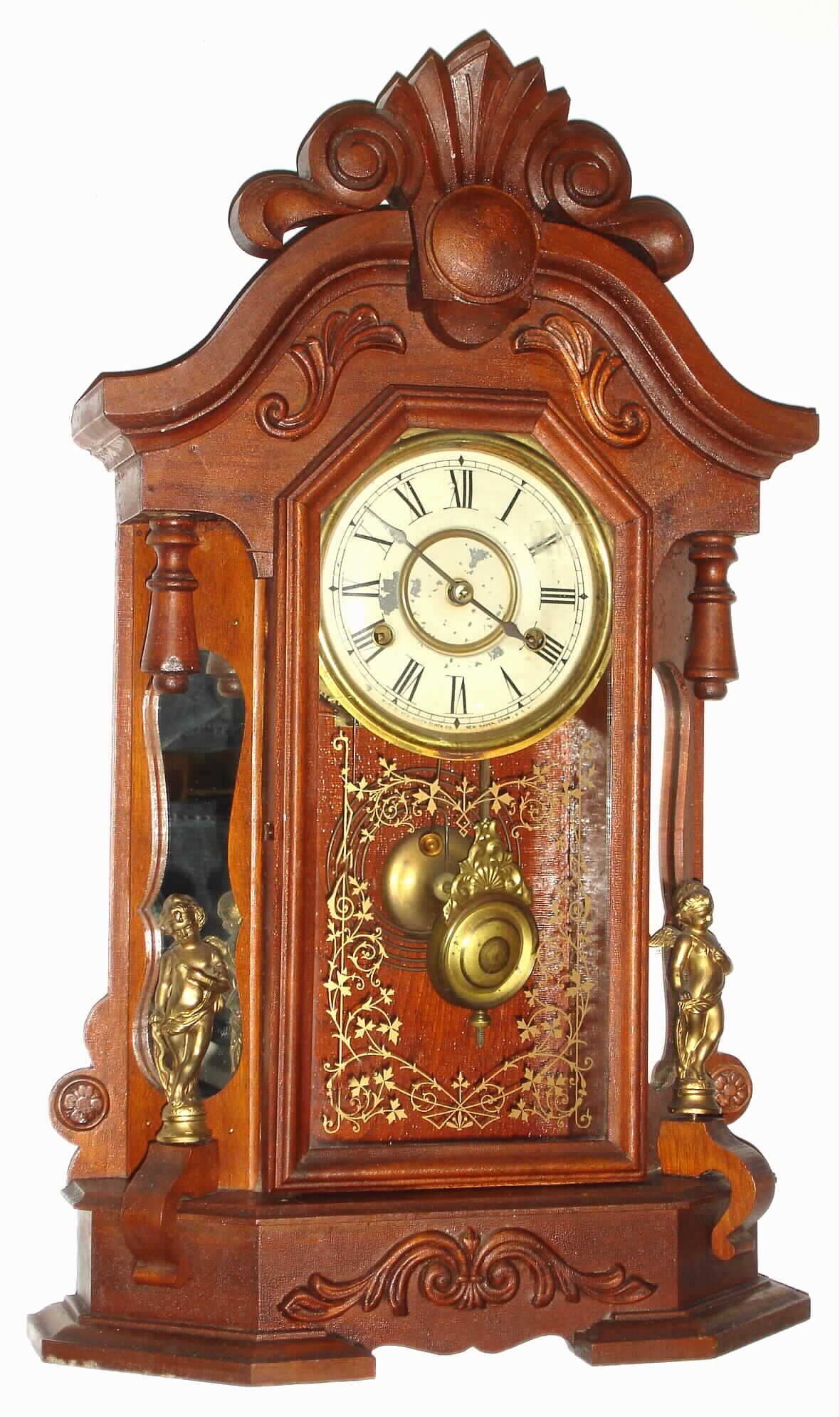 New Haven Clock Co., New Haven, Conn., "Oakdale" walnut mirror-side 8 day, time and strike mantel clock, c1900 — Antique Clocks Price Guide