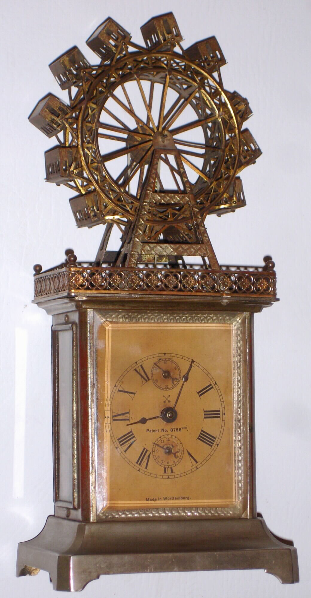 Hamburg American, Germany, c1910, 30 hour time and alarm novelty clock with large Ferris wheel, c1910 — Antique Clocks Price Guide