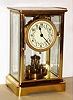 German 400 day disk pendulum clock in polished brass and beveled glass crystal regulator case, c1910