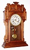 Waterbury Clock Co., Waterbury, Conn., "Niagara" walnut 8 day, time and strike calendar clock, c1911