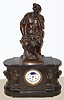 French, Barbedienne, Paris, a large marble and bronze mantel clock with perpetual calendar, and surmounted by a Greek warrior with a lions head helmet, and showing phases of the moon and center seconds, the dial flanked by two robed clerics or philosophers, and the case ends with busts of Socrates on one side and Aristotle on the other. /with damage, c1875