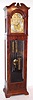 Grand Rapids Clock and Mantel Co., Grand Rapids, Michigan, 9 tube hall clock, 8 day, time, strike and chime, weight driven European movement playing Whittington or Westminster tune in mahogany case with crotch mahogany veneer front and sides and beveled glasses. The brass arched dial has a silvered chapter ring with applied brass numerals, cast spandrels and dial center, moon phase, selection for tunes or silent, and second's bit, c1910