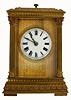 French carriage clock with petite sonnerie striking on gongs, spring powered eight day time only movement with silvered lever platform, in an ornamented Anglaise style brass case, with beveled glasses, case with Corinthian columns and foliate border top and base, straight line guilloche gilt dial mat, with white enamel Roman numeral dial, blued steel hands.     c1890