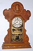 E. Ingraham, Bristol, Conn. "Admiral Dewey" oak 8 day, time and strike gingerbread clock, c1899