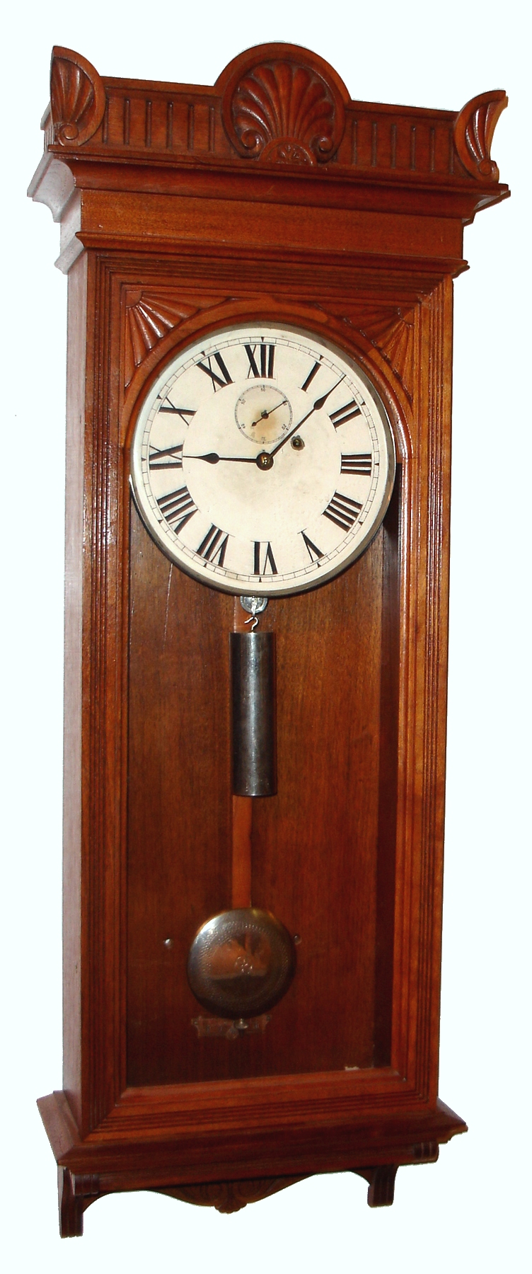 Seth Thomas Clock Co., Thomaston, Conn., "Regulator No. 9" wall clock, 8 day, time only, weight driven movement with nickel plated pulley, pendulum bob and weight in a walnut case with a painted metal dial, c1890 — Antique Clocks Price Guide