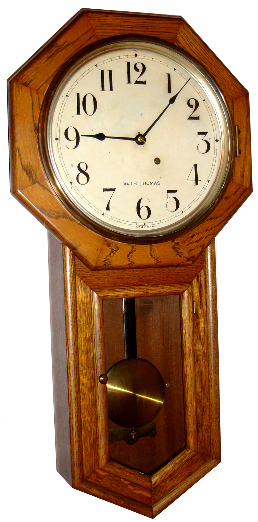 Seth Thomas Clock Co., Thomaston, Conn., "Globe" wall clock, 8 day, time only, spring driven movement in an oak case with painted metal dial, c1913 — Antique Clocks Price Guide