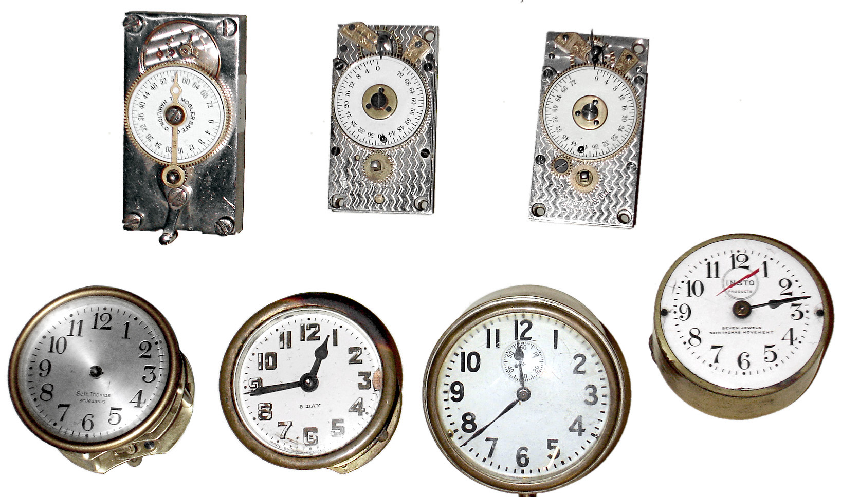 Clock movements- 7 (Seven) small 8 day timepiece works: 3 bank vault timers; 4 Seth Thomas 2.5" dials; 20th century — Antique Clocks Price Guide