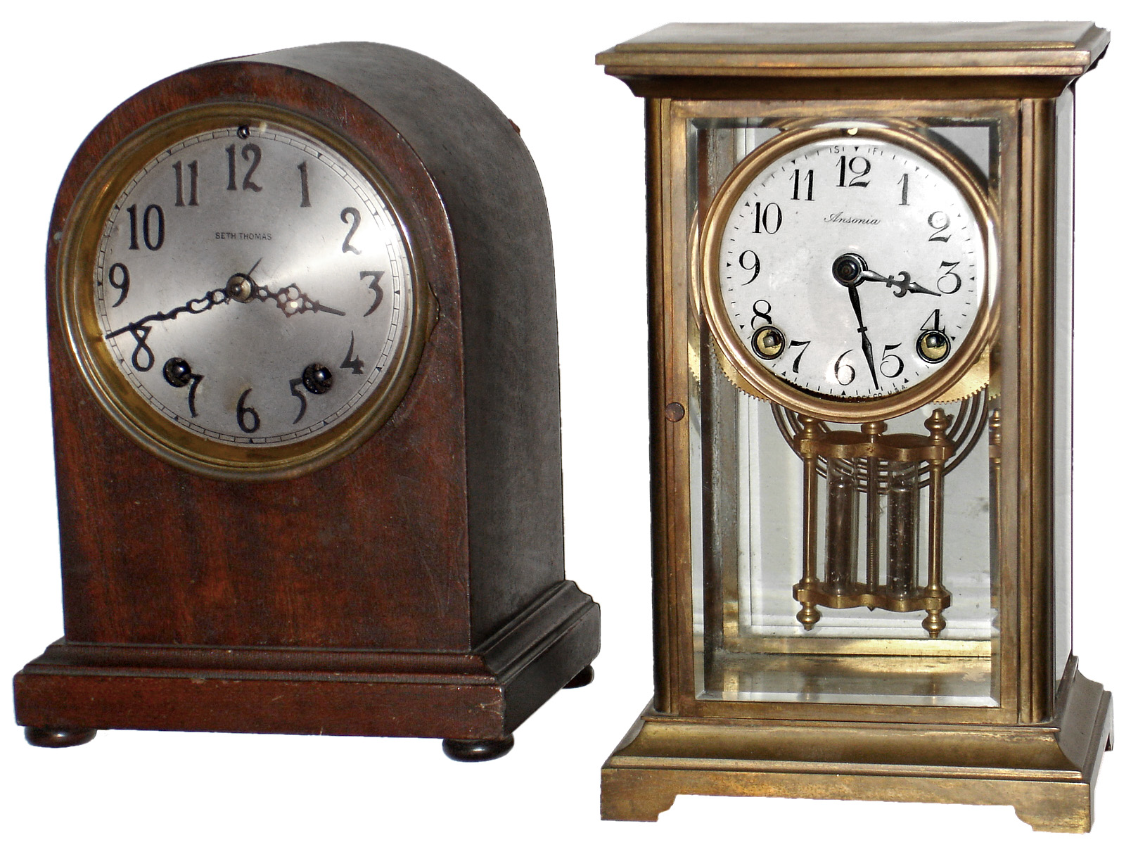 Clocks- 2 (Two) small, 8 day, time and strike, mantel clocks: Ansonia brass and glass crystal regulator; Seth Thomas mahogany round top; early 20th century — Antique Clocks Price Guide