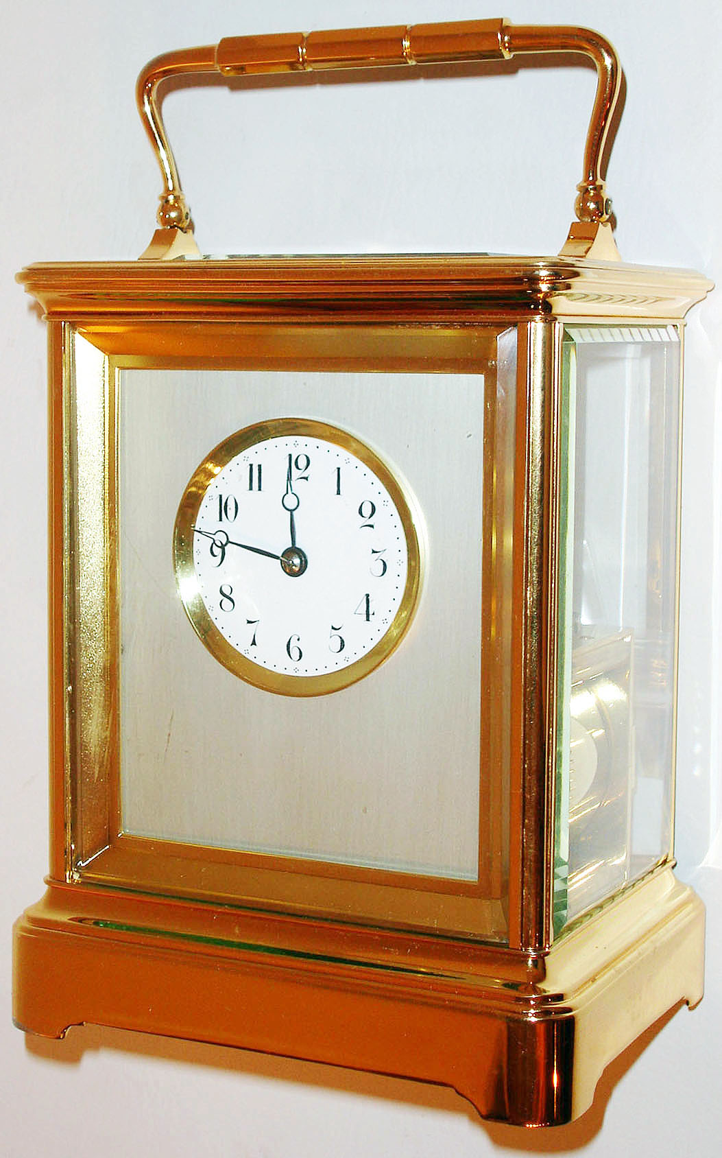 France, large and unusual year running carriage clock, the polished brass Corniche case with beveled glass panels, matte finished gilt frame for matte silver dial mat, white enamel dial with Arabic numerals, blued steel Breguet style hands with hollow tips, the movement made in two sections, the upper with a standard French carriage train, the lower with two large barrels and second wheel, engaging with the upper train, two wheels with steel end piece on back plate, large silvered lever platform, c1900 — Antique Clocks Price Guide