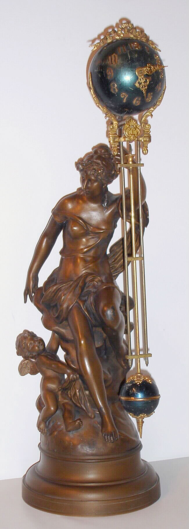 Ansonia Clock Co., New York, NY, "FORTUNA" large double figure swing clock in very good original condition, (note cherub at mother's feet)  c1905 — Antique Clocks Price Guide