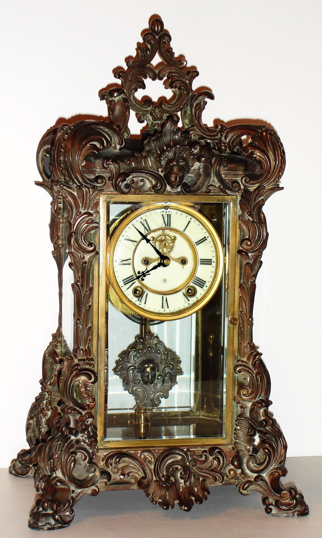 Ansonia Clock Co., New York, NY, "APEX" crystal regulator, a heavy cast metal case with bronze finish, this model and the Regal at the top of the Ansonia crystal line; c1905 — Antique Clocks Price Guide