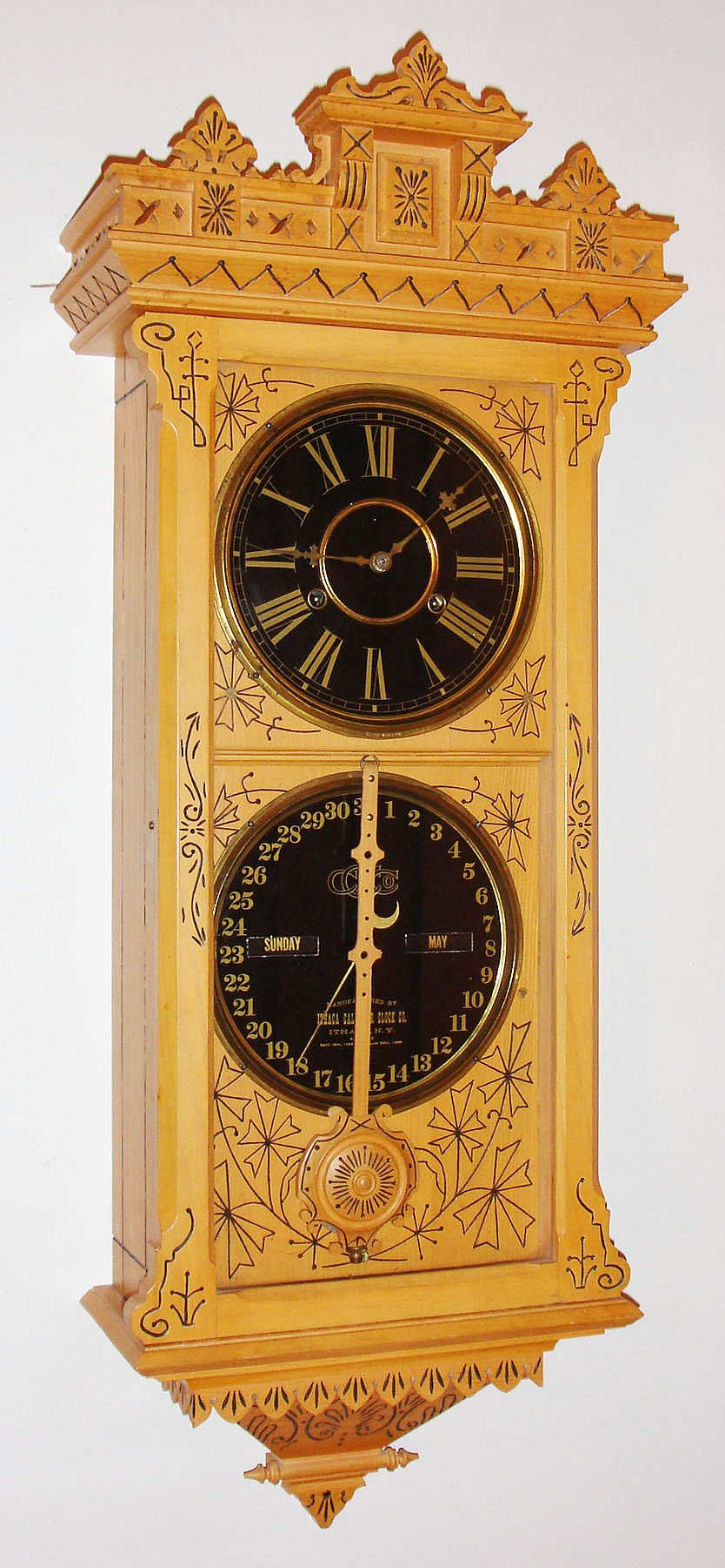 Ithaca Calendar Clock Co., Ithaca, New York "Hanging Belgrade No. 5 1/2" in new reproduction case wall clock, 30 day, time and perpetual calendar, double spring driven movement in an oak case with paper dials — Antique Clocks Price Guide