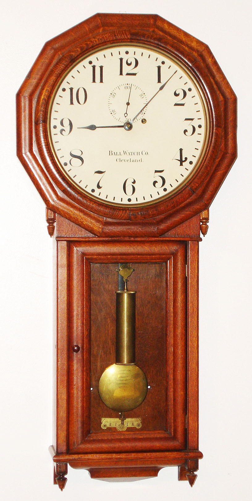 Seth Thomas Clock Co., Thomaston, Conn., "No. 3 Wall Regulator" manufactured for the Ball Watch Co., Cleveland, Ohio with 8 day, time only, weight driven movement with maintaining power in oak case with painted metal dial, c1900 — Antique Clocks Price Guide
