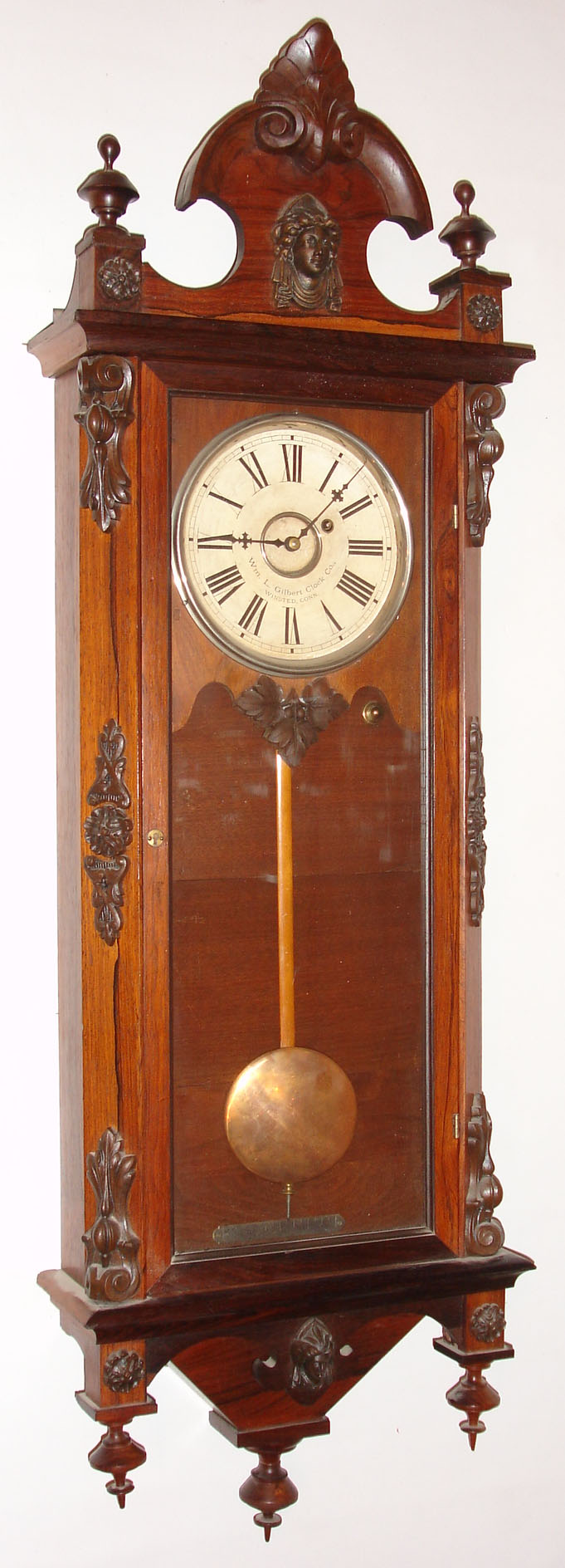 Wm. L. Gilbert Clock Co., Winsted, Conn., "Regulator No. 3" wall clock, 8 day, time only, weight driven movement in a rosewood case with applied castings and turned finials and paper dial, c1870 — Antique Clocks Price Guide