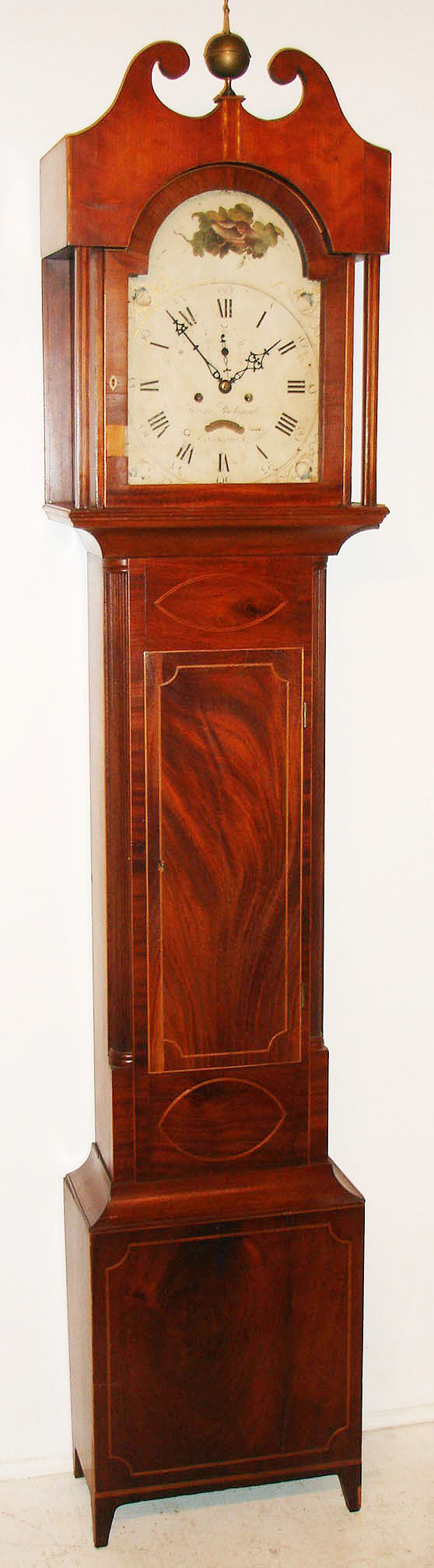 Horace Richmond, Canandaigua NY, tall clock, 8 day, time and bell strike, weight driven movement in a solid cherry and mahogany veneer case with string inlay on trunk and hood on tapered Hepplewhite feet with painted iron dial decorated with conch shell in arch and American shields in spandrels, c1815 — Antique Clocks Price Guide