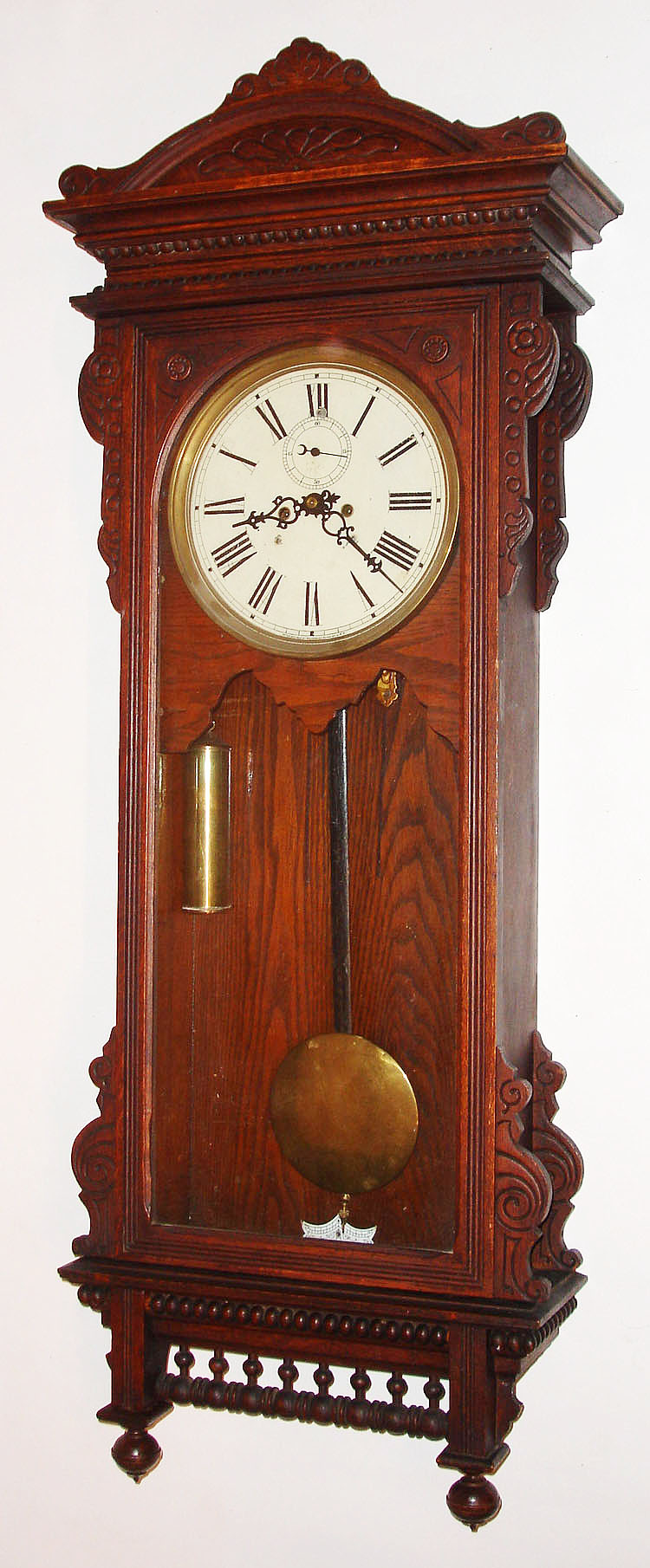 Waterbury Clock Co., Waterbury, Conn., "Regulator No. 57", 8 day, double weight oak case wall timepiece, c1906 — Antique Clocks Price Guide