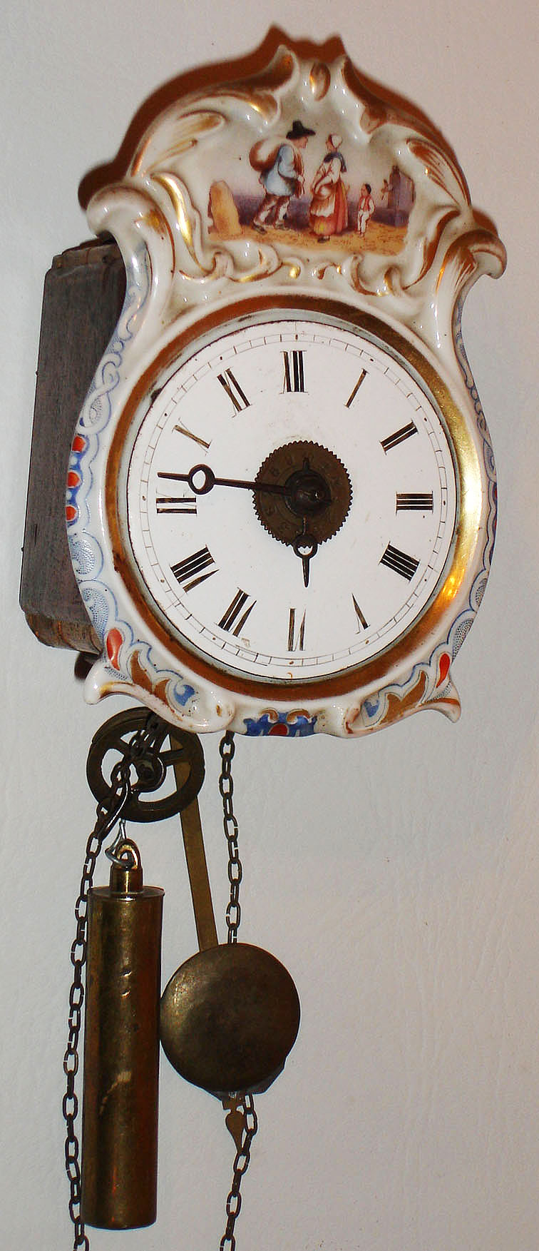 German, miniature Jockele, porcelain front 30 hour wood plate time and strike, c1850 — Antique Clocks Price Guide