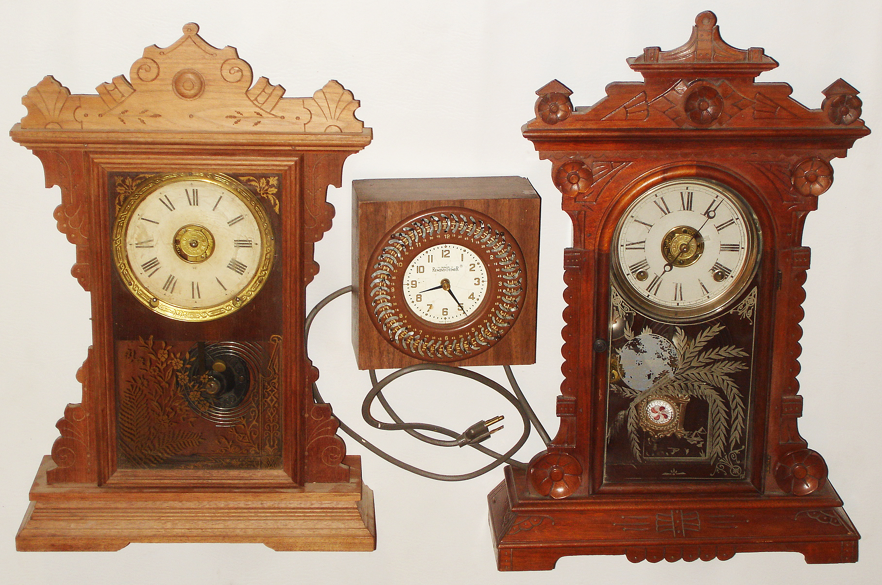 Clocks- 3 (Three):  E.N. Welch "Hatton" mahogany, 8 day, time and strike, parlor clock; Seth Thomas Clock Co., Thomaston, Conn., "Dover" oak, 8 day, time and strike, kitchen clock; James "Remindotimer" electric; 19th &n 20th centuries — Antique Clocks Price Guide