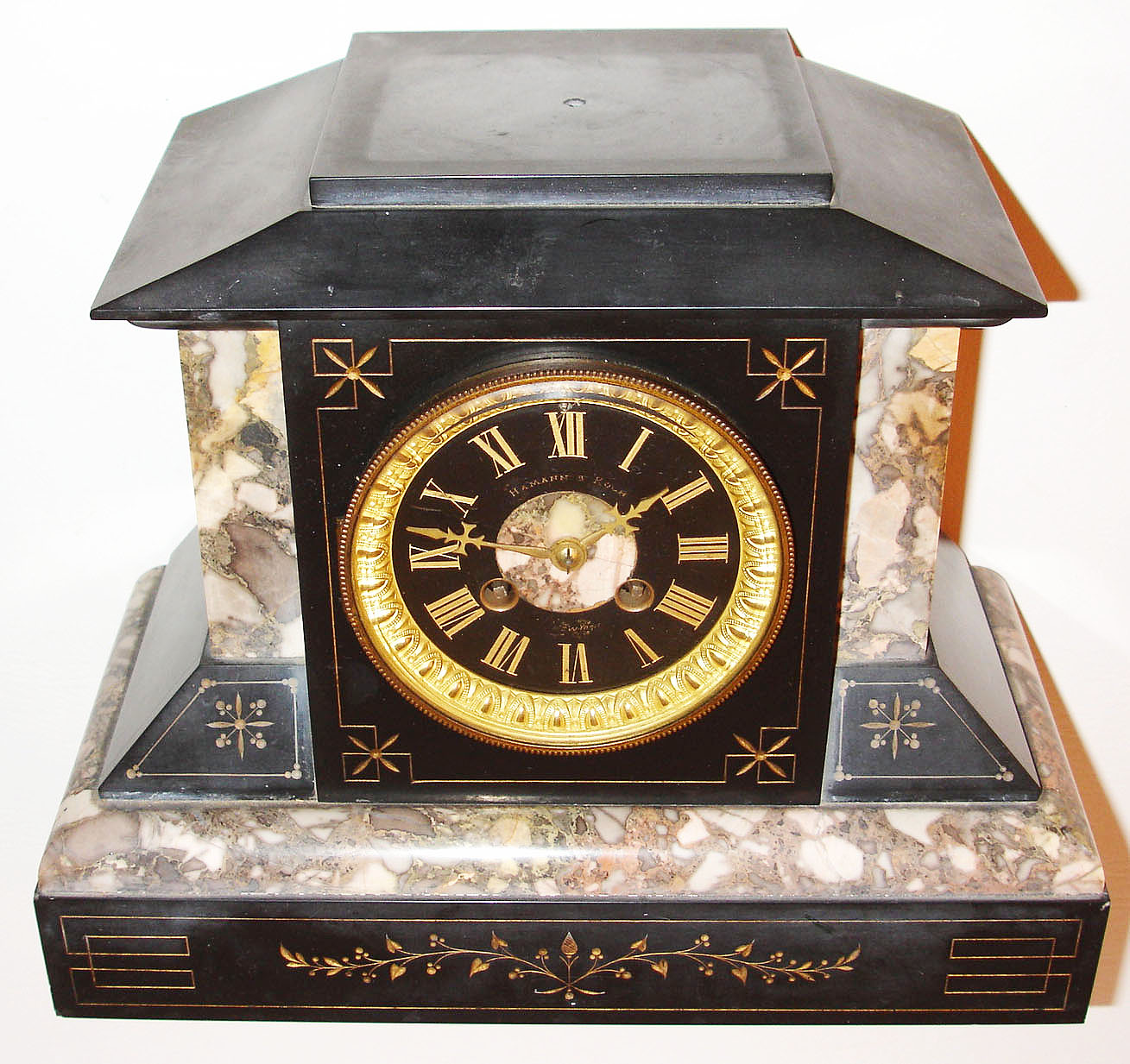 France, Belgian slate mantel clock with multi colored marble moldings, gilt incised vine, leaf and line decoration, black slate dial with gilt incised Roman numerals, signed "Harmann and Koch New York", gilt hands, gilt bezel with thick beveled glass, 8 day, time and strike, pendule a Paris movement signed Marti, c1880 — Antique Clocks Price Guide
