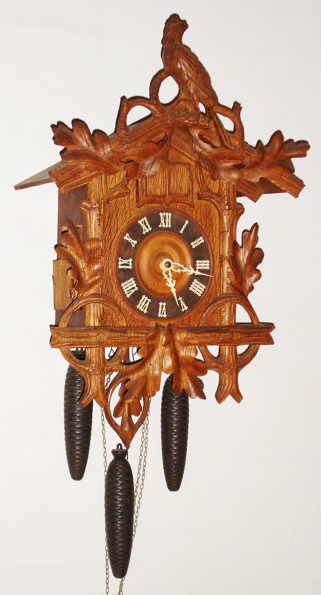 German cuckoo and quail 30 hour quarter-striking three weight wall clock, shown in 1903 Sears catalog. — Antique Clocks Price Guide
