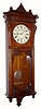 Seth Thomas Clock Co., Thomaston, Conn., "Marcy" wall clock, 8 day, time and quarter strike on two cup bells and hours on a cathedral gong, spring driven movement in a walnut case with painted metal dial, dated 1886