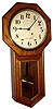 Seth Thomas Clock Co., Thomaston, Conn., "Globe" wall clock, 8 day, time only, spring driven movement in an oak case with painted metal dial, c1913