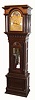 Walter H. Durfee, Providence, Rhode Island, for Bailey, Banks and Biddle, Philadelphia, Penn. on dial, 9 tube hall clock, 8 day, time, strike and 1/4 chime three weight driven movement playing Westminster or Whittington tune on tubes signed by Walter Durfee with patent date 1887 and with single jar mercury pendulum.  The silvered brass dial has moon phase with elk scene, strike / silent and tune selector discs.  The case is oak with a dark walnut finish and has carved cornice moldings, 11 raised panels, barley twist columns, of which four are flanking the trunk and two are flanking hood, sunburst carving above trunk door and beveled glass in hood and trunk doors.  There are exceptional lion's head escutcheons on both hood and trunk doors, c1895