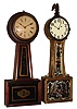 Clocks- 2 (Two) American full-size mahogany 8 day banjo timepieces: one gold-front weight-driven, c.1880, with modern movement; and a rare early Brewster and Ingraham spring-wound with black/gold glasses c1850.