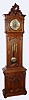 Austrian, floor standing 2nd Baroque style Vienna regulator, 8 day, time and Grande Sonnerie strike, three engraved brass weight driven movement with fancy engraved brass pendulum bob  in an ornately carved walnut case with silvered brass round dial, w/ engraved dial center, c1875