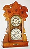 Charles W. Feishtinger, Fritztown, Pa, 8 day, time and strike calendar shelf clock.  These clocks were manufactured by Waterbury Clock Co. for him.  This model with modifications to the base is the "Hebron".