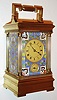 France, eight day hour repeating time, probably strike and alarm carriage clock, Anglaise Riche case with very nice champleve enamel panels, the foliate design in bright blues, greens, and reds, beveled glass in back door and top, matte gilt Roman numeral dial, blued steel hands, movement with silvered lever platform, c1880