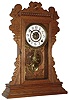 Waterbury Clock Co., Waterbury, Conn., "Mansfield", 8 day, time and strike, oak kitchen clock, c1891.