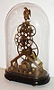 Reproduction modern Asian skeleton timepiece with fusee and oversize great wheel oval glass dome, late 20th century
