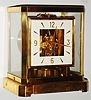 LeCoultre and Co., Swiss, "Atmos" perpetual wind gold plated brass and glass mantel clock, 1961 presentation