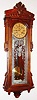 Ansonia Clock Co., New York, NY, "Bagdad" wall clock, 8 day, time only, two weight driven movement in a mahogany case with silk screened pattern and Ansonia logo and paper dial, c1904