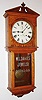 Seth Thomas Clock Co., Thomaston, Conn., "Umbria" wall clock, 15 day, time only, double spring driven movement in an oak case with painted metal dial and advertising tablet for "W.L. DAVIES JEWELER Cor. 5th and LaBelle" on lower door, c1894