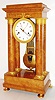 Brocot, France, large portico clock with pinwheel escapement, round time and strike movement with large barrels, possibly of two week duration, count wheel striking on a bell, crutch with fine beat adjustment, white enamel dial signed "Brocot", gilt Breguet style hands, with sweep seconds, heavy gilt brass and steel gridiron pendulum with knife edge suspension beating half seconds, the case veneered in figured ash, with gilt bezel, column mounts, and feet, with gilt beat scale, c1830