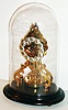 Gustav Becker, Germany, skeleton form 400 day torsion pendulum clock, the movement of year duration with polished brass plates, deadbeat escapement, with Medaille d'Or on back plate, silvered Arabic numeral dial and blued steel hands, polished brass disc pendulum with faint serial number matching that o f the movement, mounted to an oval wooden base, and covered with a conforming oval dome, serial #2135603, c1900
