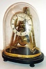 English fusee skeleton clock with platform escapement, polished A frame plates with 4 bold baluster form pillars, vertically mounted silvered platform with duplex escapement marked "Philcox 277 Patent", the brass balance with blued steel spring, silvered Roman numeral dial with seconds at 12:00, blued steel hands, mounted on a black painted velvet covered base, and covered by a conforming glass dome, c1850