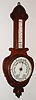 Barometer, probably English, oak aneroid instrument with mercury dual scale thermometer, c1920