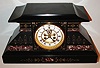 France, Belgian slate mantel clock with red and white marble moldings, gilt incised line and leaf decoration, white enamel Roman numeral dial with blued steel hands, gilt bezel with thick beveled glass, 8 day pendule a Paris time and strike movement signed Marti with Brocot open escapement, c1880