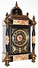 France, Belgian slate and multi colored marble mantel clock, the front with incised gilt and silvered ornament depicting two Phoenix eating snakes flanking a central urn, with trailing leaves, vines, and flowers, the front corners with turned slate and marble columns with gilt bronze finials and feet, the case top with Gothic inspired gilt bronze surround and slate dome, with bronze finial, black slate dial with incised gilt Arabic numerals, colored marble center, marked "W. H. Glenny and Sons and Co. Buffalo" with gilt hands, French, 8 day, time and strike, movement with square plates, c1885