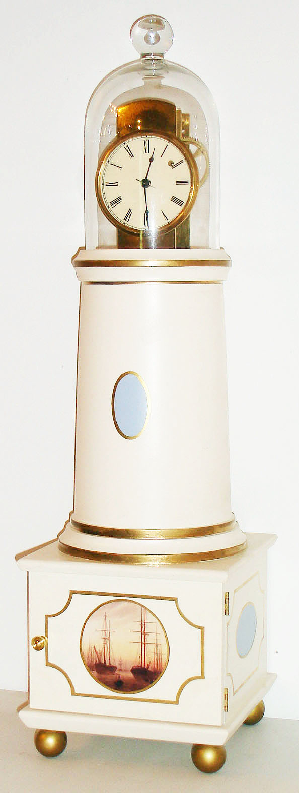 Simon Willard lighthouse bridal clock reproduction by the Petrick Clock Company of Port St. Lucie Florida, 8 day, time only, weight driven movement with a t-bridge, anchor recoil escapement and polished solid brass plates. The movement is mounted in a hand turned solid hardwood painted case, with hand blown glass dome and painted roman numeral dial, c2000 — Antique Clocks Price Guide