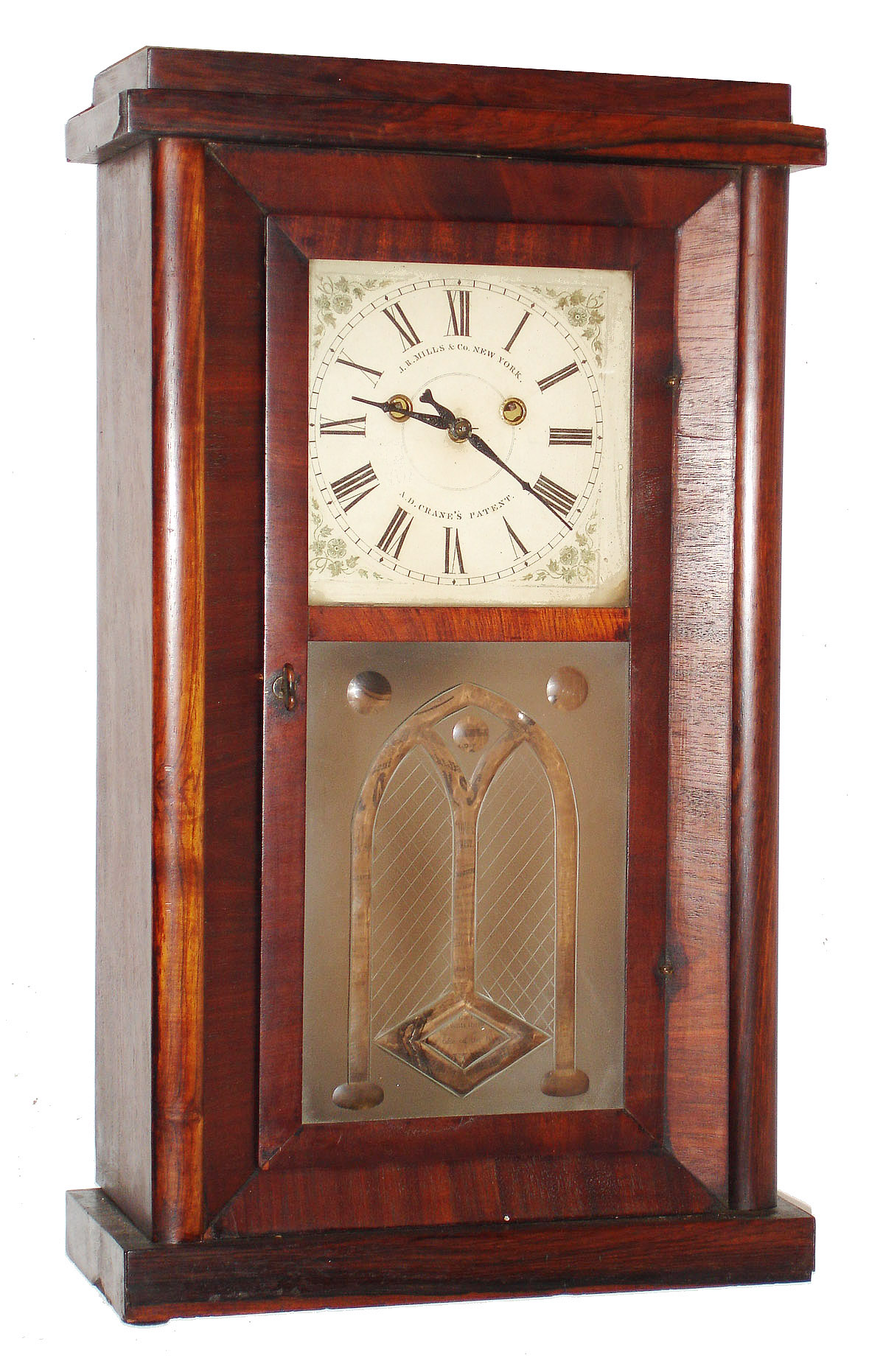 J. R. Mills and Co., New York, Crane's Patent, 8 day, time and strike, two weights three ball rotary pendulum shelf clock. c1846.  This model was made in Bellesville, New Jersey and sold by the Year Clock Co. from its store in New York.  The J.R. Mills & Co. was located in Bellesville. Examples of the case with pictures of the movement can be found in: "NAWCC supplement 16, summer 1987, Aaron Dodd Crane, An American Original", pg 71. — Antique Clocks Price Guide