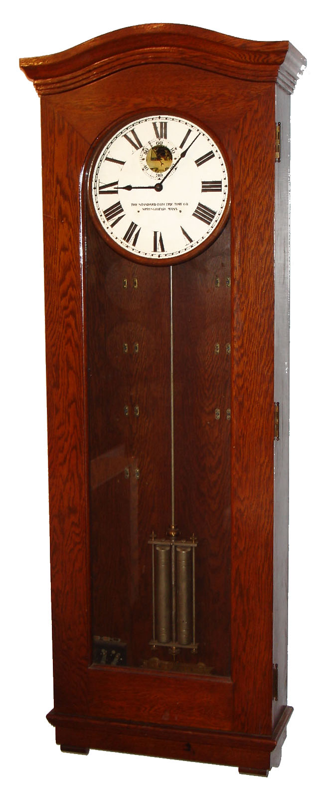 Standard Electric Time Co., Springfield, Mass., "Master Clock", time only, electrical driven in an oak case with mercury pendulum and painted metal dial, c1925 — Antique Clocks Price Guide