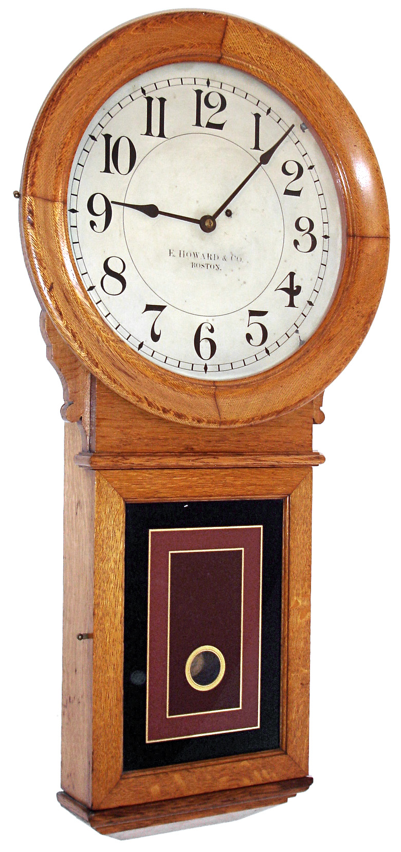 E. Howard & Co., Boston, Mass., "No. 70 Regulator" with 16" dial, wall clock, 8 days, time only, weight driven movement in an oak case with painted metal dial and reverse painted lower tablet, c1890 — Antique Clocks Price Guide