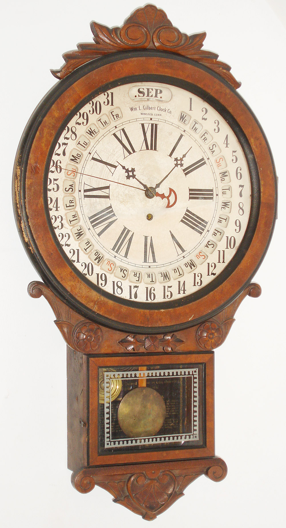 Wm. L. Gilbert Clock Co., Winsted, Conn., "Office Drop Calendar" walnut 8 days, time only, wall clock with Maranville style rotating calendar, c1881 — Antique Clocks Price Guide