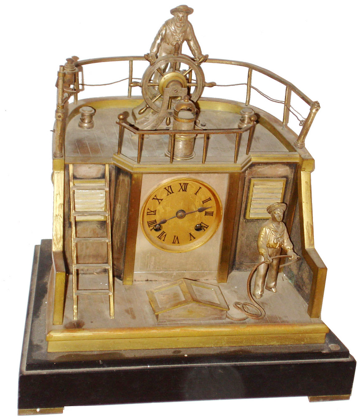 French industrial "Ships Stern" clock by Guilmet, signed 8 days, time and strike, movement mounted in a silvered and gilt case representing a ships quarter deck, the captain rocking back and forth at the wheel as the upper part of the compound pendulum, with knife edge suspension, deck railing with gimbaled lamps, and a sailor coiling rope below, gilt Roman numeral dial with blued steel hands, all on a black slate base with gilt feet, c1885 — Antique Clocks Price Guide